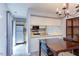 Cozy dining area featuring modern lighting fixture and access to the kitchen at 159 Finley Forest Dr, Chapel Hill, NC 27517