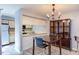 Bright dining room with kitchen access and a stylish chandelier at 159 Finley Forest Dr, Chapel Hill, NC 27517