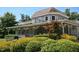 Spacious gray home with a large porch, manicured landscaping, and decorative trim at 159 Finley Forest Dr, Chapel Hill, NC 27517