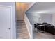 Living room and staircase with a desk, chair and sofa at 159 Finley Forest Dr, Chapel Hill, NC 27517