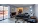 Open-concept living room showcasing staircase, access to the patio, and a view to the dining area at 159 Finley Forest Dr, Chapel Hill, NC 27517