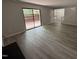 Bright living room with sliding glass doors leading to a wooden deck and modern flooring at 159 Finley Forest Dr, Chapel Hill, NC 27517