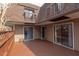 Inviting outdoor space with wooden patio, sliding glass doors, and balcony views at 159 Finley Forest Dr, Chapel Hill, NC 27517