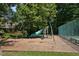 Community playground area with swings, slide, and wood chip ground at 159 Finley Forest Dr, Chapel Hill, NC 27517
