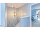A staircase with an overhead light fixture is leading to the second floor at 159 Finley Forest Dr, Chapel Hill, NC 27517
