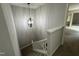 Carpeted staircase with modern railing and stylish light fixture at 159 Finley Forest Dr, Chapel Hill, NC 27517
