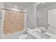 Bright bathroom featuring a shower-tub combo, vanity with sink and a large mirror at 1723 Starlit Sky Ln, Cary, NC 27519