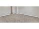 View of unfurnished bedroom with carpeted floor and view into walk-in closet at 1723 Starlit Sky Ln, Cary, NC 27519