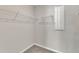 Walk-in closet with shelving for storage in new construction home at 1723 Starlit Sky Ln, Cary, NC 27519