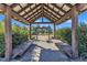 Open-air gazebo with benches and beautiful views of greenery and trees at 1723 Starlit Sky Ln, Cary, NC 27519