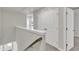 Upstairs hallway with carpeted floor, white trim, and closet storage area at 1723 Starlit Sky Ln, Cary, NC 27519