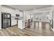 Modern kitchen with stainless steel appliances, white cabinets, and a center island with seating at 1723 Starlit Sky Ln, Cary, NC 27519