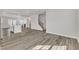 Spacious open-concept living area connects kitchen, fireplace, and stairs in a harmonious design at 1723 Starlit Sky Ln, Cary, NC 27519