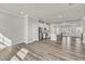 Open-concept living space flows into a modern kitchen, perfect for entertaining guests and Gathering at 1723 Starlit Sky Ln, Cary, NC 27519