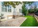 Well-maintained backyard with an outdoor patio and lush green lawn at 1800 Pierre Pl, Apex, NC 27502