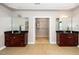 Bright primary bathroom with double vanity sinks and access to a walk-in closet at 1800 Pierre Pl, Apex, NC 27502