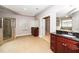 Well-lit bathroom with double vanity, a walk-in shower, and a soaking tub at 1800 Pierre Pl, Apex, NC 27502