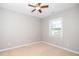 Neutrally painted bedroom with natural light and ceiling fan at 1800 Pierre Pl, Apex, NC 27502
