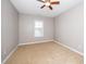 Neutral bedroom with window and ceiling fan at 1800 Pierre Pl, Apex, NC 27502