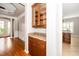 Butler's pantry featuring granite countertops and display cabinets at 1800 Pierre Pl, Apex, NC 27502