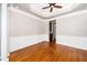 Spacious dining room featuring hardwood flooring, large windows, and detailed molding at 1800 Pierre Pl, Apex, NC 27502