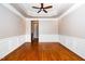 Spacious dining room featuring hardwood flooring, large windows, and detailed molding at 1800 Pierre Pl, Apex, NC 27502