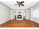 Bright open living room with hardwood floors and recessed lighting, featuring a fireplace at 1800 Pierre Pl, Apex, NC 27502