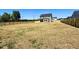 Spacious backyard featuring newly constructed home, with a wooden fence and seeded yard at 20 Eagle Crest Court Way # Holly Farmhouse, Lillington, NC 27546
