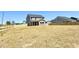 New home backyard with wooden fence and seeded grass at 20 Eagle Crest Court Way # Holly Farmhouse, Lillington, NC 27546