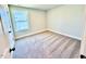 Bright bedroom with carpet flooring and large window at 20 Eagle Crest Court Way # Holly Farmhouse, Lillington, NC 27546