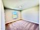 This bedroom offers neutral walls, carpet and a window providing natural light at 20 Eagle Crest Court Way # Holly Farmhouse, Lillington, NC 27546