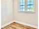 Bedroom featuring wood-look floors, neutral walls, and natural light at 20 Eagle Crest Court Way # Holly Farmhouse, Lillington, NC 27546