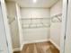 Walk-in closet with ample storage shelving and carpet flooring at 20 Eagle Crest Court Way # Holly Farmhouse, Lillington, NC 27546