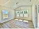 Bright dining area with modern chandelier and big sunny windows at 20 Eagle Crest Court Way # Holly Farmhouse, Lillington, NC 27546