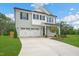 Charming two-story home with a manicured lawn, a two-car garage, and a classic white facade at 20 Eagle Crest Court Way # Holly Farmhouse, Lillington, NC 27546