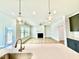 Bright open concept living room with modern pendant lights, fireplace, and wood floors at 20 Eagle Crest Court Way # Holly Farmhouse, Lillington, NC 27546