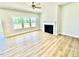 Spacious living room with a fireplace, and ample natural light at 20 Eagle Crest Court Way # Holly Farmhouse, Lillington, NC 27546