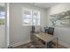 Well-lit office space with hardwood floors, a large window, and modern desk setup at 20 Eagle Crest Court Way # Holly Farmhouse, Lillington, NC 27546
