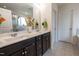 Beautiful bathroom featuring a double vanity, framed mirror, and decorative accents at 207 Kinnakeet Dr, Durham, NC 27704