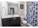 Full bathroom featuring dark cabinets, white countertops, and a shower at 207 Kinnakeet Dr, Durham, NC 27704