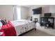 Cozy bedroom featuring a fireplace, TV, and comfortable seating at 207 Kinnakeet Dr, Durham, NC 27704