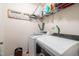 Convenient laundry room with modern appliances, storage, and decor at 207 Kinnakeet Dr, Durham, NC 27704