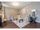 Spacious living room with hardwood floors, comfortable sectional sofa, and elegant decorations at 207 Kinnakeet Dr, Durham, NC 27704