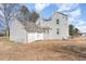 Back exterior view of the home and detached garage at 2110 Cokey Rd, Rocky Mount, NC 27801