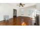 Bright living room with fireplace, hardwood floors, and access to other rooms at 2110 Cokey Rd, Rocky Mount, NC 27801