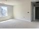 Bedroom features large windows and natural light at 212 Fast Pitch Ln, Four Oaks, NC 27524
