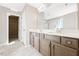 Bathroom featuring double sinks, tile flooring, and a walk-in closet at 212 Wildwood Ln, Graham, NC 27253
