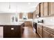 Stylish kitchen with a central island, granite countertops, and stainless steel appliances at 212 Wildwood Ln, Graham, NC 27253