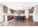 Spacious kitchen featuring granite counters, stainless appliances, and a large center island at 212 Wildwood Ln, Graham, NC 27253