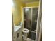 Cozy bathroom featuring a standard toilet, vanity, and shower with glass doors at 216 Clayton St, Rocky Mount, NC 27803